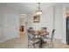 Small dining area with a table and four chairs at 628 Cleveland St # 1201, Clearwater, FL 33755