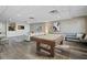 Common area with pool table and comfortable seating at 628 Cleveland St # 1201, Clearwater, FL 33755