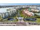 Aerial view showcasing condo building and waterfront location at 7893 Sailboat Key S Blvd # 304, South Pasadena, FL 33707