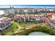 Aerial view highlighting a condo building near waterfront at 7893 Sailboat Key S Blvd # 304, South Pasadena, FL 33707