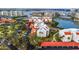 Aerial view of waterfront condo community with pool and marina at 7893 Sailboat Key S Blvd # 304, South Pasadena, FL 33707
