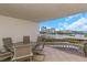 Balcony with water views and seating for six at 7893 Sailboat Key S Blvd # 304, South Pasadena, FL 33707