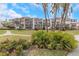 Exterior view of the building and landscaping at 7893 Sailboat Key S Blvd # 304, South Pasadena, FL 33707