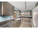 Kitchen featuring granite countertops and ample cabinetry at 7893 Sailboat Key S Blvd # 304, South Pasadena, FL 33707