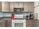 View of kitchen stovetop, microwave, and coffee maker at 7893 Sailboat Key S Blvd # 304, South Pasadena, FL 33707