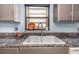 Kitchen sink with granite countertop and window at 7893 Sailboat Key S Blvd # 304, South Pasadena, FL 33707