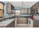 Bright kitchen features granite countertops and modern appliances at 7893 Sailboat Key S Blvd # 304, South Pasadena, FL 33707