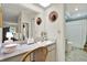 Bathroom with vanity, a large mirror, and shower/tub combo at 8086 Annwood Rd, Seminole, FL 33777