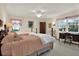Spacious bedroom with two twin beds, a desk, and plenty of natural light at 8086 Annwood Rd, Seminole, FL 33777