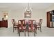 Classic dining room with wood table and chairs, ready for gatherings at 8086 Annwood Rd, Seminole, FL 33777