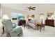 Bright living room featuring comfortable seating and a large window at 8086 Annwood Rd, Seminole, FL 33777