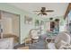Sunroom with wicker furniture and access to the backyard at 8086 Annwood Rd, Seminole, FL 33777