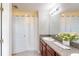 Clean bathroom with granite countertop and shower at 10251 Carloway Hills Dr, Wimauma, FL 33598