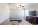 Bedroom with built-in desk and a comfortable bed at 10251 Carloway Hills Dr, Wimauma, FL 33598