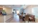 Kitchen and dining area with breakfast nook and modern lighting at 10251 Carloway Hills Dr, Wimauma, FL 33598