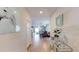 A view down a light and bright hallway showcasing stylish decor at 10251 Carloway Hills Dr, Wimauma, FL 33598