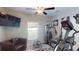 Home gym with exercise machine and comfortable seating at 10251 Carloway Hills Dr, Wimauma, FL 33598