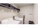 Well-equipped laundry room with washer, dryer, and storage at 10251 Carloway Hills Dr, Wimauma, FL 33598