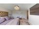 Main bedroom with large bed, TV, and cozy sitting area at 10251 Carloway Hills Dr, Wimauma, FL 33598