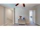 Upstairs hallway with mirrored cabinet and view of bedroom at 10251 Carloway Hills Dr, Wimauma, FL 33598
