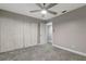 Bedroom with ceiling fan, carpet, and large closet at 104 Capri S Ct, Plant City, FL 33566