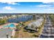 Aerial view of community pool, buildings, and waterfront location at 107 Seahorse Se Dr # A, St Petersburg, FL 33705