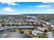 Aerial view of waterfront community with pool and lush landscaping at 107 Seahorse Se Dr # A, St Petersburg, FL 33705