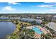 Aerial view showcasing community pool and surrounding buildings at 107 Seahorse Se Dr # A, St Petersburg, FL 33705