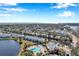 Aerial view of waterfront community with pool and lush landscaping at 107 Seahorse Se Dr # A, St Petersburg, FL 33705