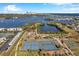 Aerial view of tennis courts, pickleball courts, and a basketball court at 107 Seahorse Se Dr # A, St Petersburg, FL 33705
