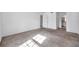 Well-lit bedroom with carpet flooring and ample space at 107 Seahorse Se Dr # A, St Petersburg, FL 33705