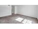 Large bedroom with carpet and access to hallway at 107 Seahorse Se Dr # A, St Petersburg, FL 33705