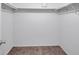 Walk-in closet with shelves and hanging rods at 107 Seahorse Se Dr # A, St Petersburg, FL 33705