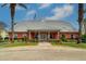 Community building with a metal roof and welcoming entrance at 107 Seahorse Se Dr # A, St Petersburg, FL 33705