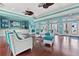 Bright and airy community room with comfortable seating and hardwood floors at 107 Seahorse Se Dr # A, St Petersburg, FL 33705