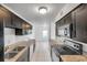 Modern kitchen with dark cabinets and granite countertops at 107 Seahorse Se Dr # A, St Petersburg, FL 33705