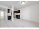 Modern kitchen with dark cabinets, granite counters, and stainless steel appliances at 107 Seahorse Se Dr # A, St Petersburg, FL 33705