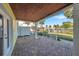 Brick paved patio with wooden covered ceiling at 107 Seahorse Se Dr # A, St Petersburg, FL 33705