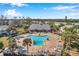 Community pool with plenty of lounge chairs and patio space at 107 Seahorse Se Dr # A, St Petersburg, FL 33705