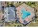 Community pool with surrounding lounge chairs and patio at 107 Seahorse Se Dr # A, St Petersburg, FL 33705