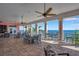 Spacious waterfront patio featuring ceiling fans and beautiful water views at 107 Seahorse Se Dr # A, St Petersburg, FL 33705