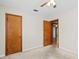 Nice bedroom with ceiling fan and access to another room at 10930 N Edison Ave, Tampa, FL 33612