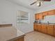 Kitchen with wood cabinets and stainless steel appliances at 10930 N Edison Ave, Tampa, FL 33612