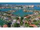 Aerial view showcasing waterfront property with boat access and lush landscaping at 1200 80Th S St, St Petersburg, FL 33707