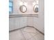 Bright bathroom with double vanity and updated fixtures at 1200 80Th S St, St Petersburg, FL 33707