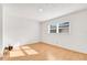 Simple bedroom with hardwood floors and large window at 1200 80Th S St, St Petersburg, FL 33707