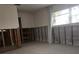 A bedroom undergoing renovation, with exposed framing and new flooring at 1200 80Th S St, St Petersburg, FL 33707
