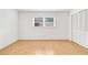 Simple bedroom with light walls, wood floors, and built-in closet at 1200 80Th S St, St Petersburg, FL 33707