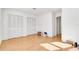 Spacious bedroom with light wood floors and a large closet at 1200 80Th S St, St Petersburg, FL 33707