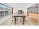 Bright dining room with a farmhouse table and seating for six at 1200 80Th S St, St Petersburg, FL 33707